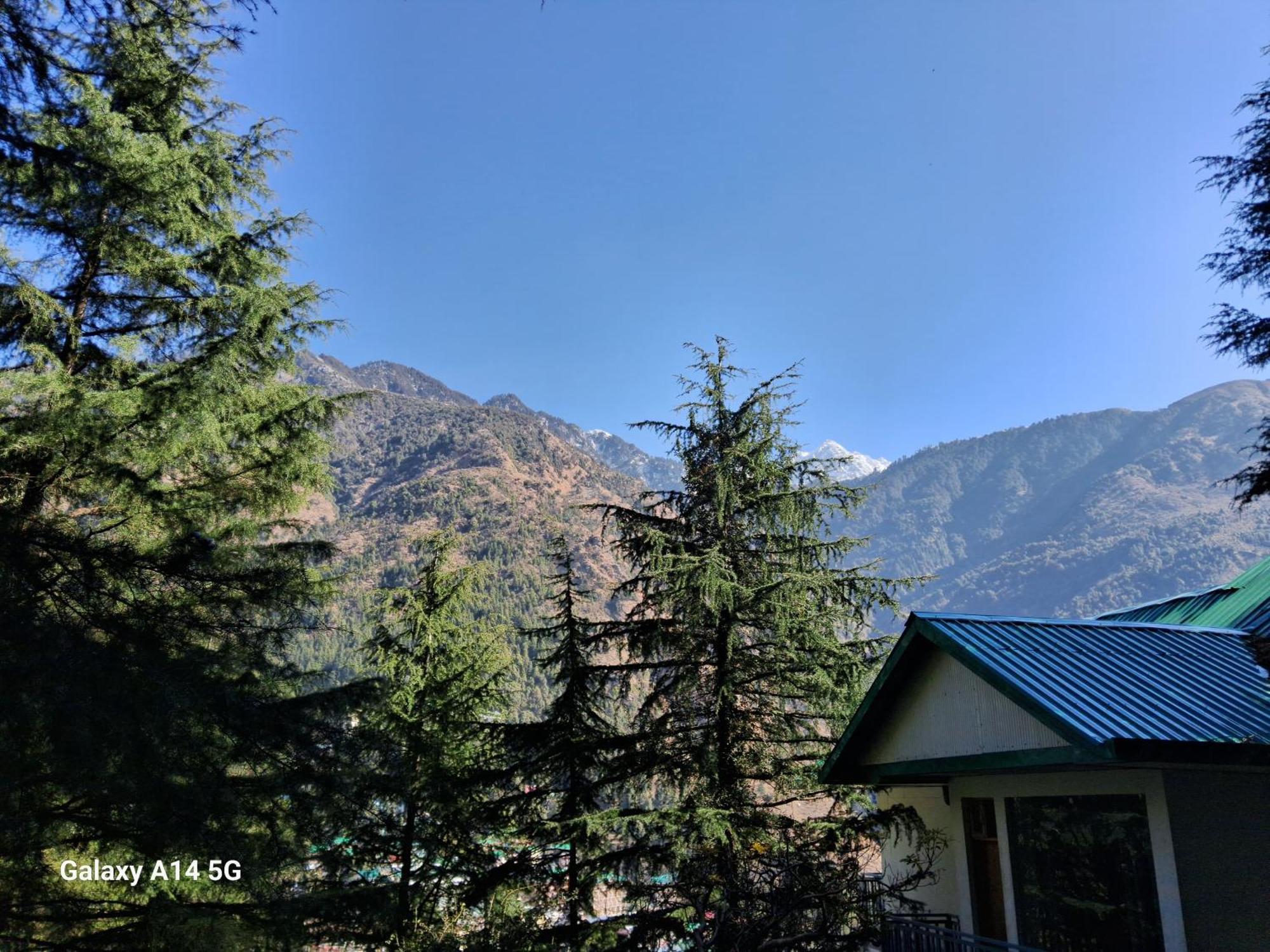 Himalayan Mountain Trekkers And Waterfalls View